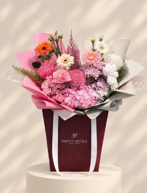 Pinks in the burgundy bag