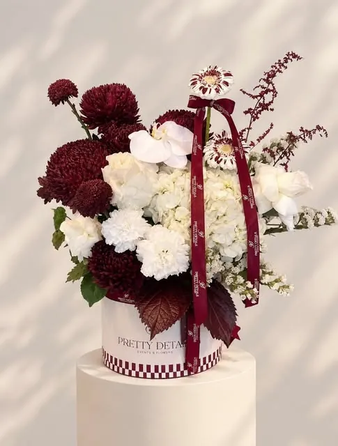 Burgundy and white hatbox